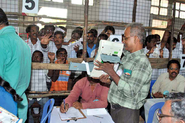 man-hold-evm-machine